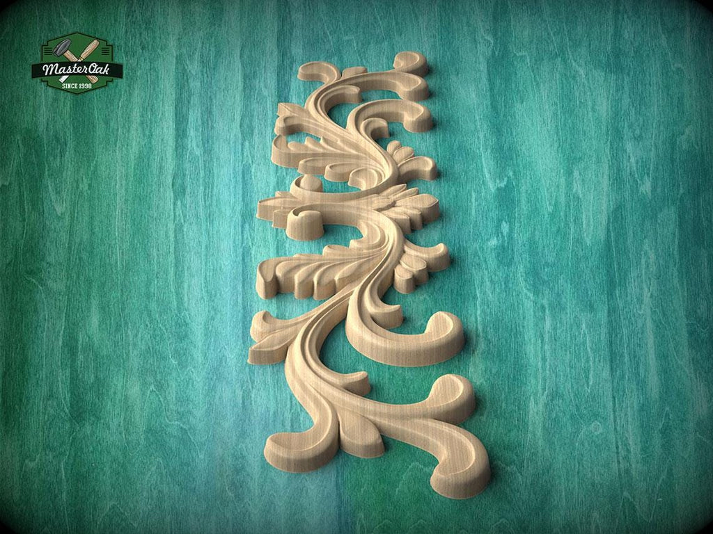 A decorative wooden carving in the shape of a leaf or flower is displayed against a teal-colored background.