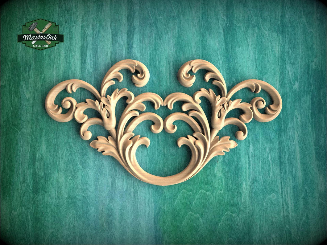 an ornate, carved wooden piece with intricate scrollwork and floral designs, set against a green background.