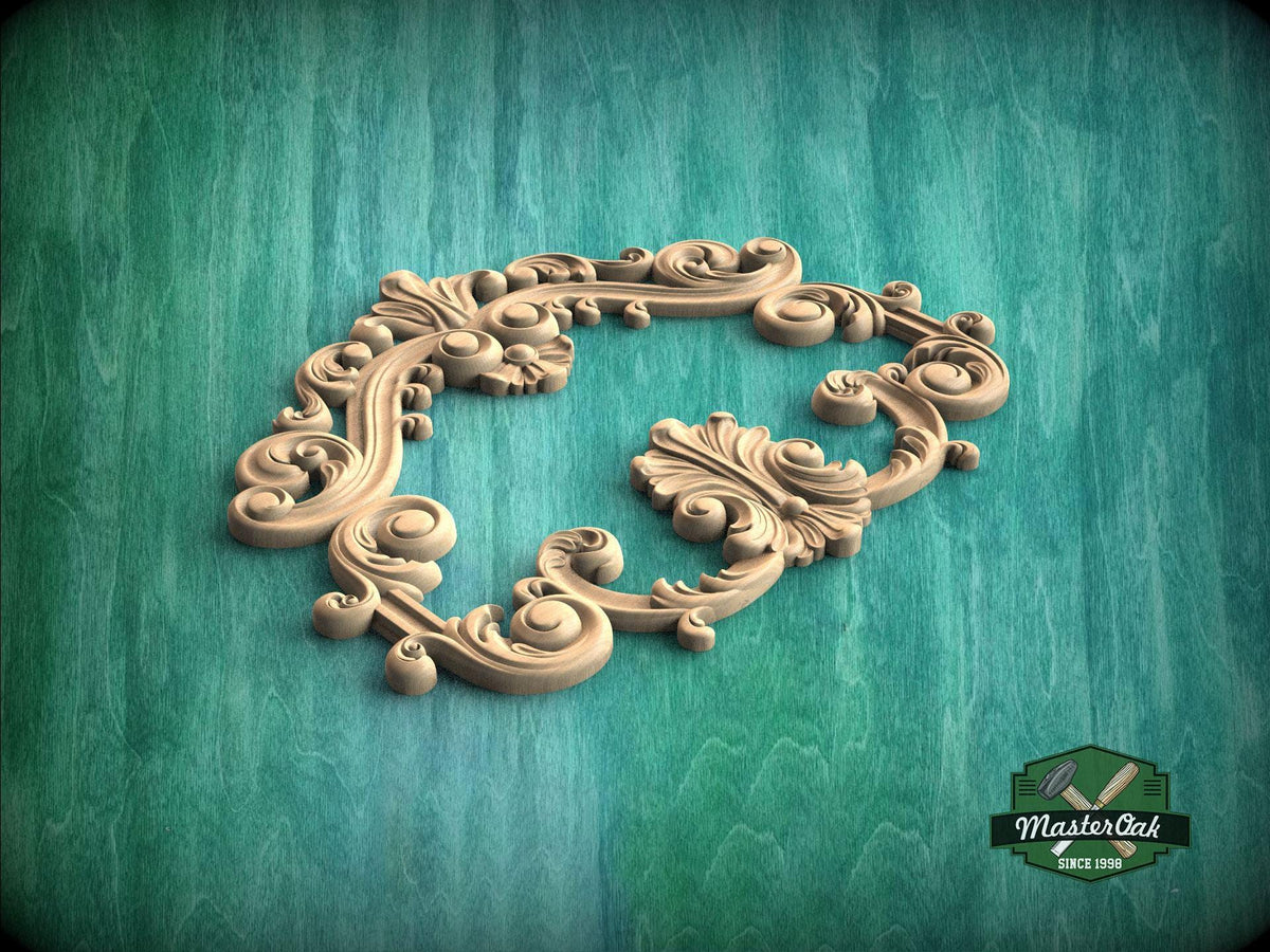 an ornate, carved wooden frame with intricate scrollwork and floral designs, set against a green background.