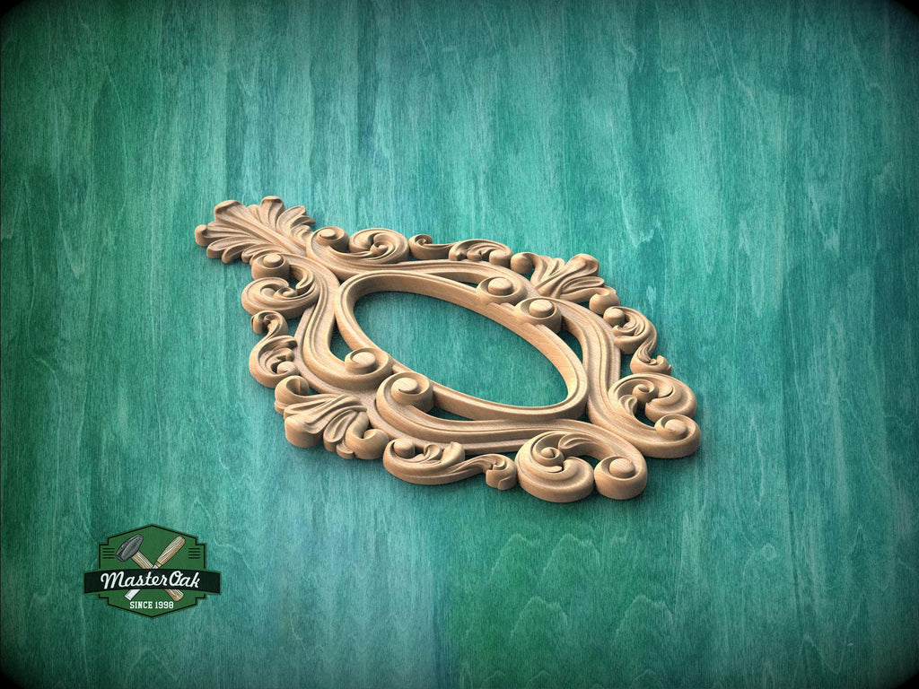 A decorative wooden frame with an ornate, floral design is displayed against a green textured background.