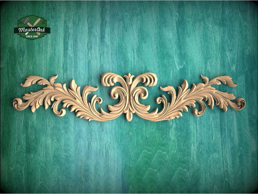 a wood carving of an ornate design on a green background