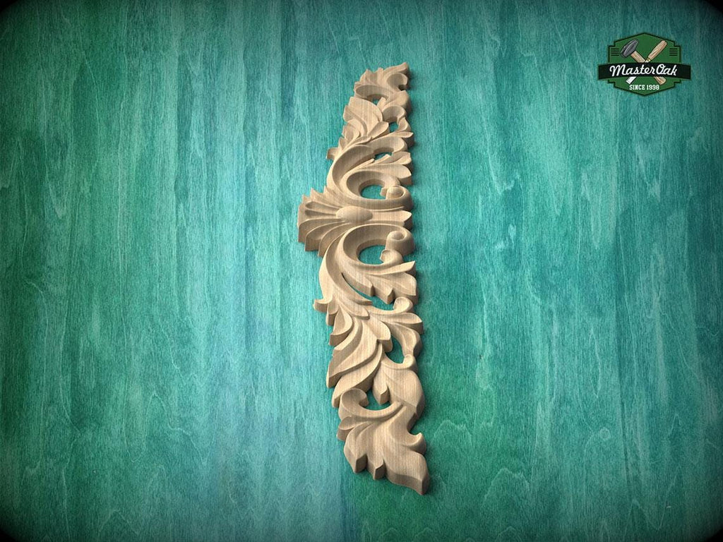A decorative wooden carving in the shape of a vertical column is displayed against a green textured background.