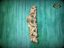 Load image into Gallery viewer, A decorative wooden carving in the shape of a vertical column is displayed against a green textured background.
