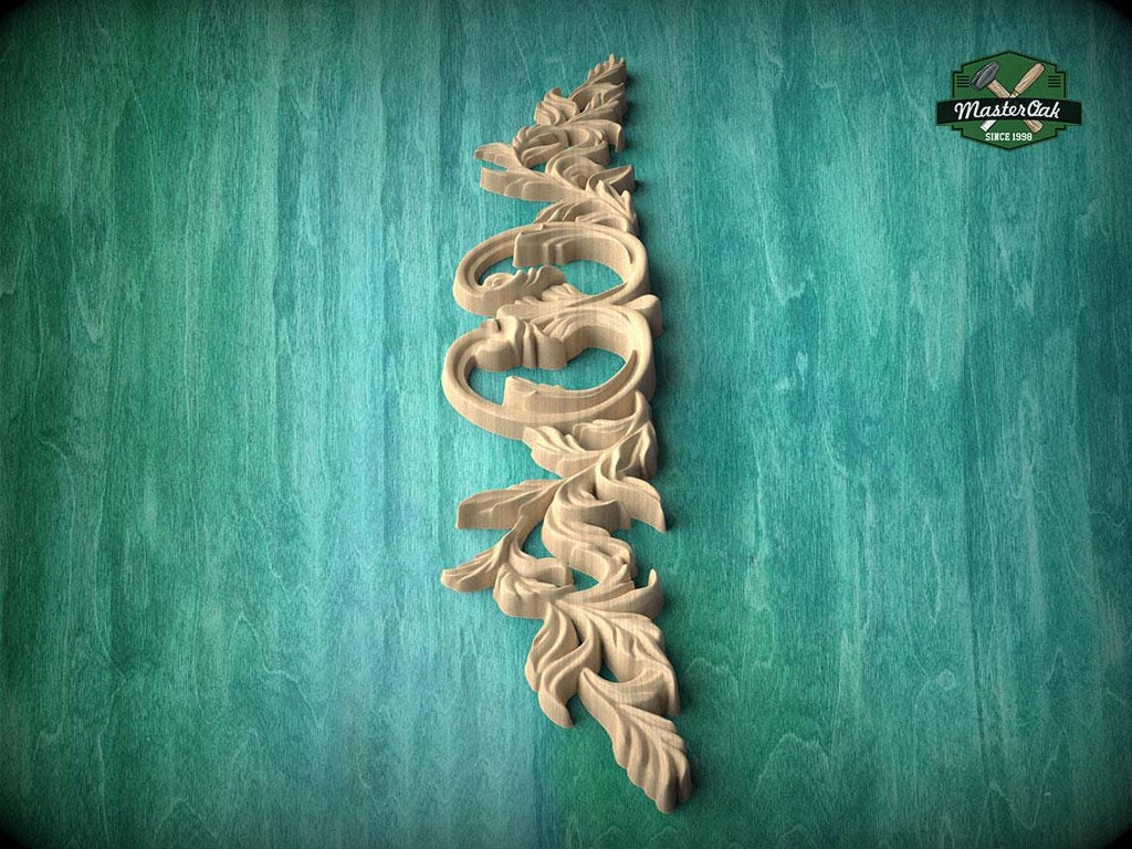 A decorative wooden carving in the shape of a leaf or branch is displayed against a green background.