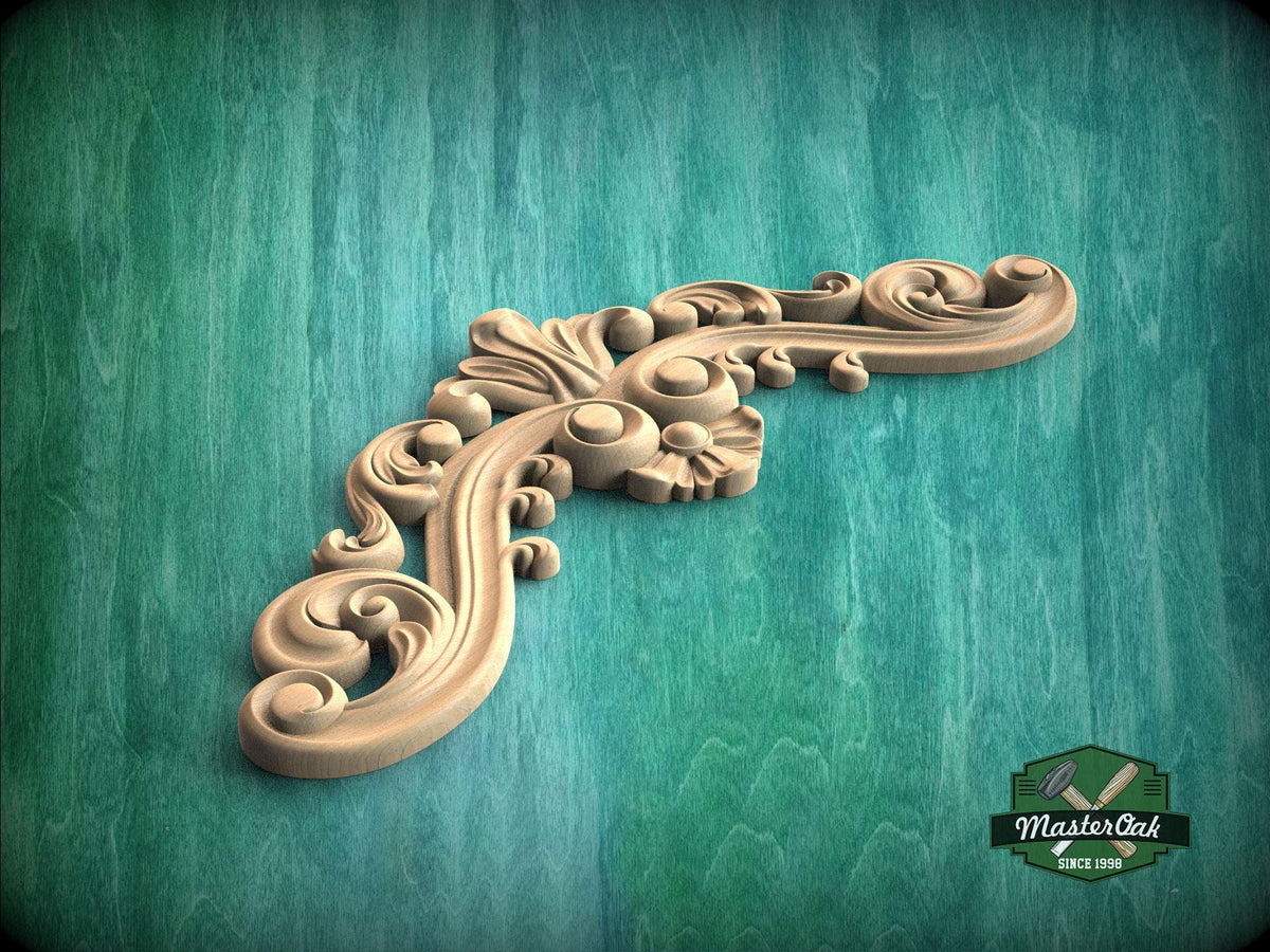 A decorative wooden carving with intricate swirls and curves is displayed against a green background.