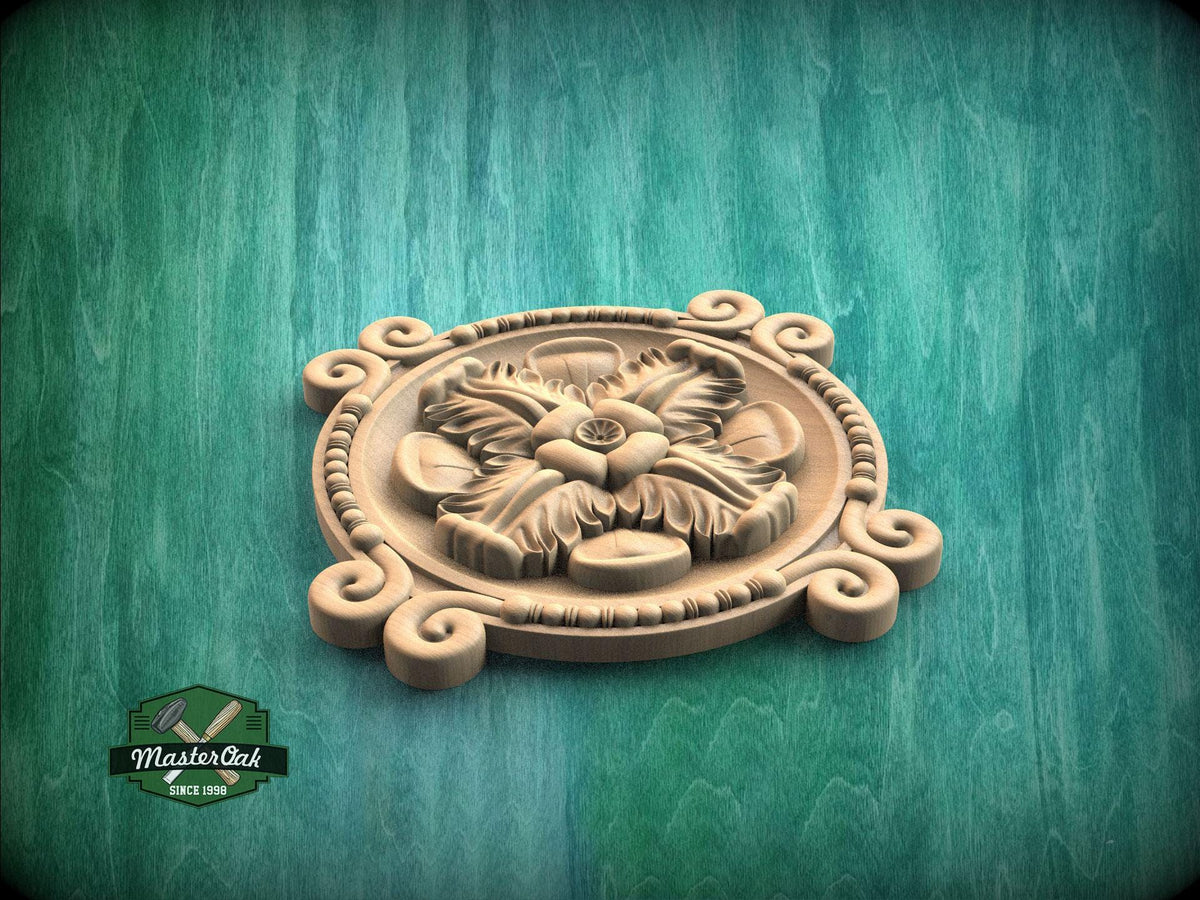 A wooden ornamental piece with a floral design, placed on a green wooden surface.