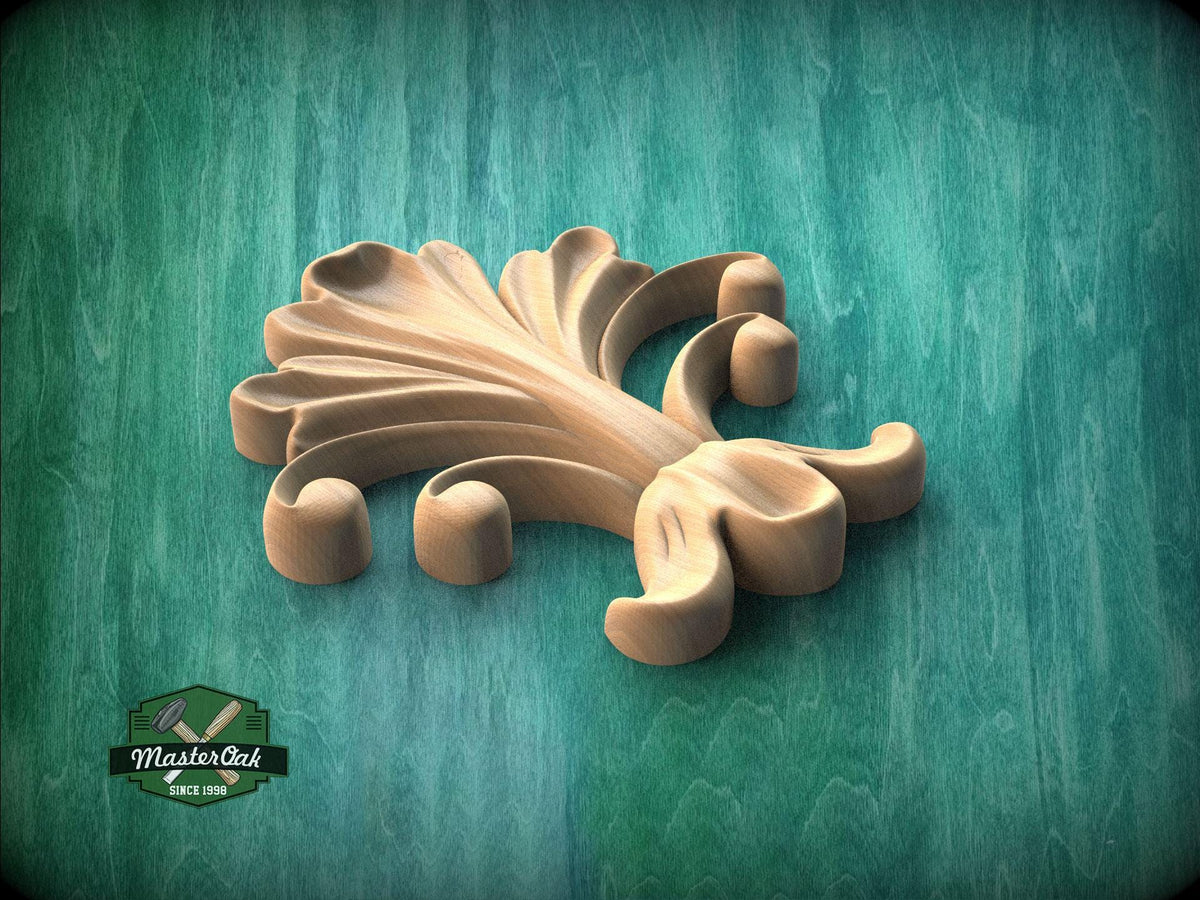 A wooden carving of a stylized flower or leaf design is displayed against a green background.