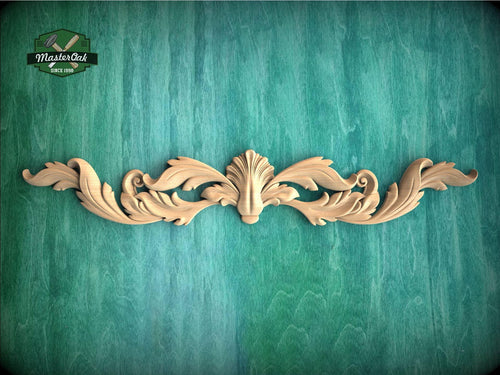 a wooden carving of a flower on a green background