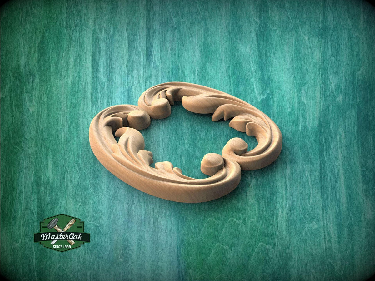 A wooden carving of a stylized leaf or flower design is displayed against a green textured background.