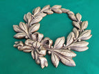 Laurel wreath of wood, bays carved in wood, wreath on the wall
