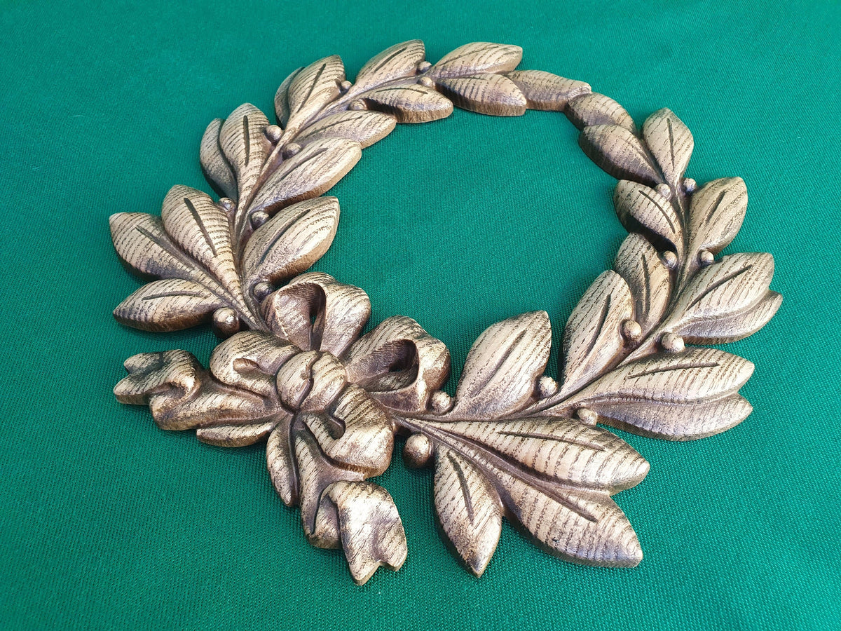 Laurel wreath of wood, bays carved in wood, wreath on the wall