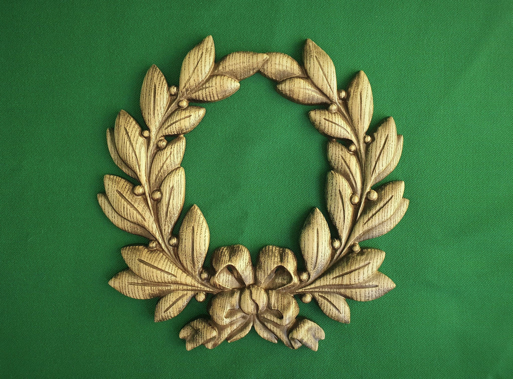 Laurel wreath of wood, bays carved in wood, wreath on the wall
